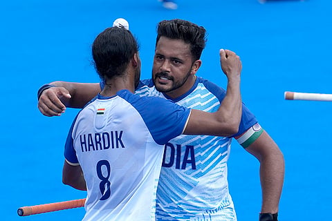 Harmanpreet Singh celebrates with Hardik after scoring his side's second goal 